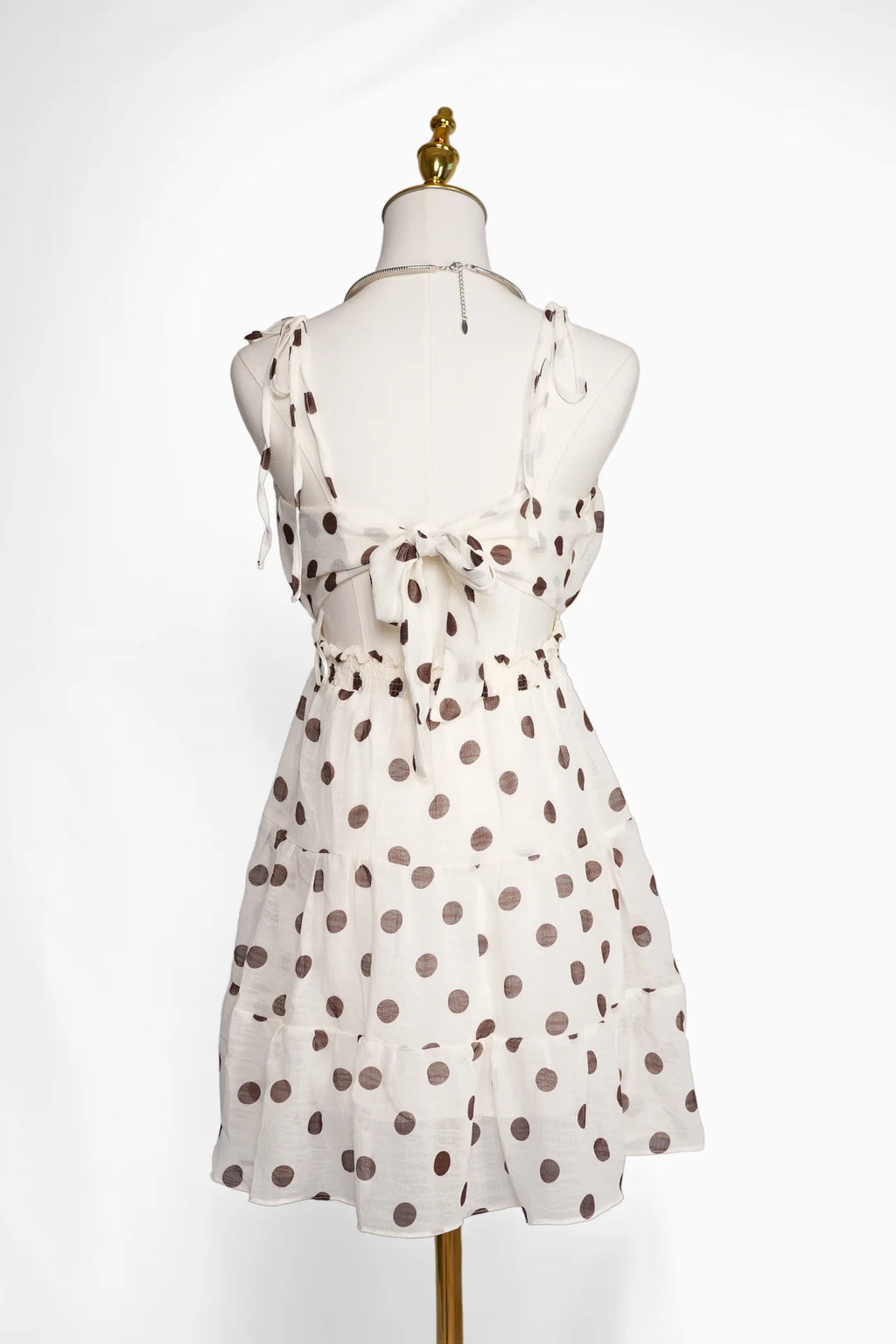 Arioma modelo 25, Blanco con lunares marrones. Maniquí · Espalda